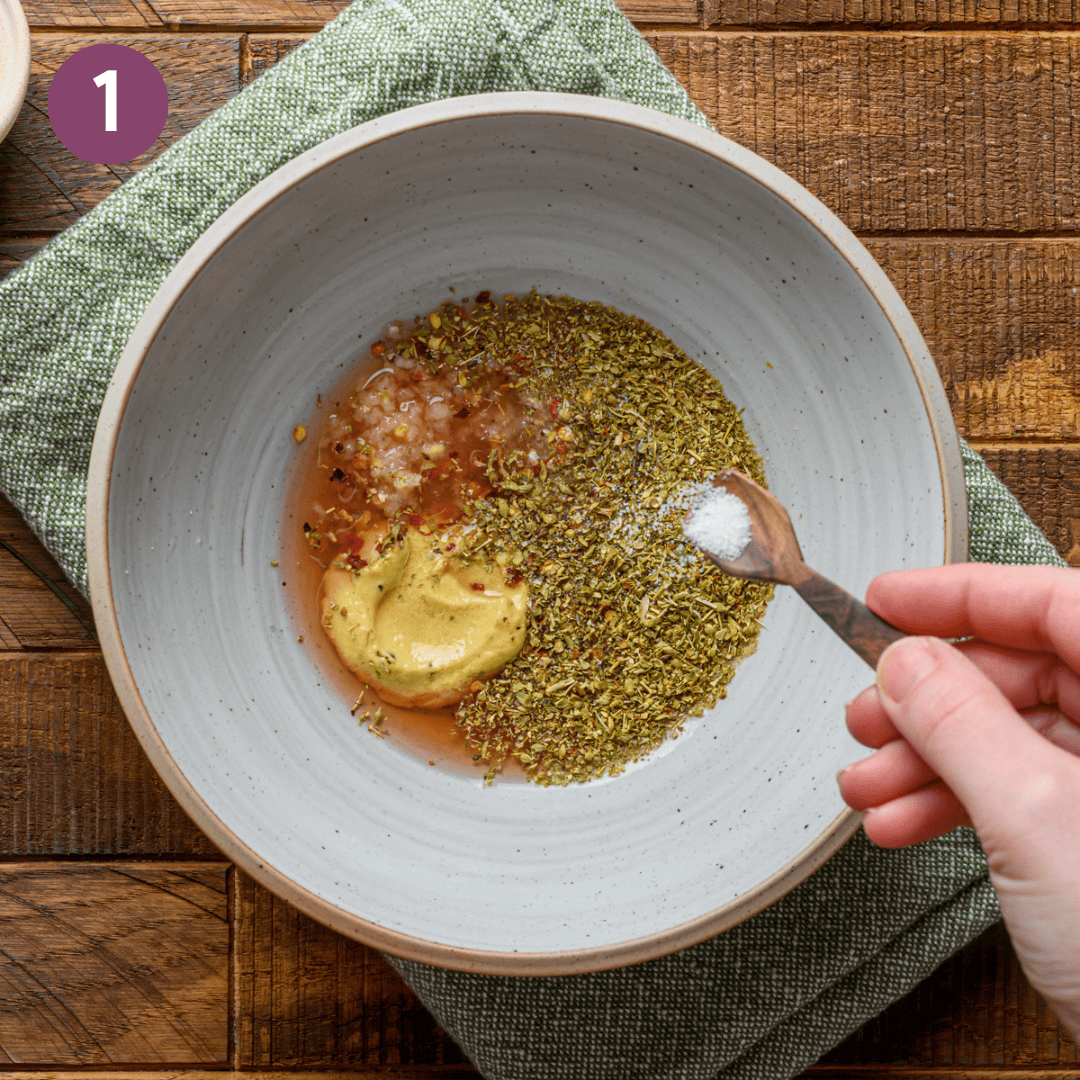 red wine vinaigrette ingredients minus oil in a bowl before being mixed.