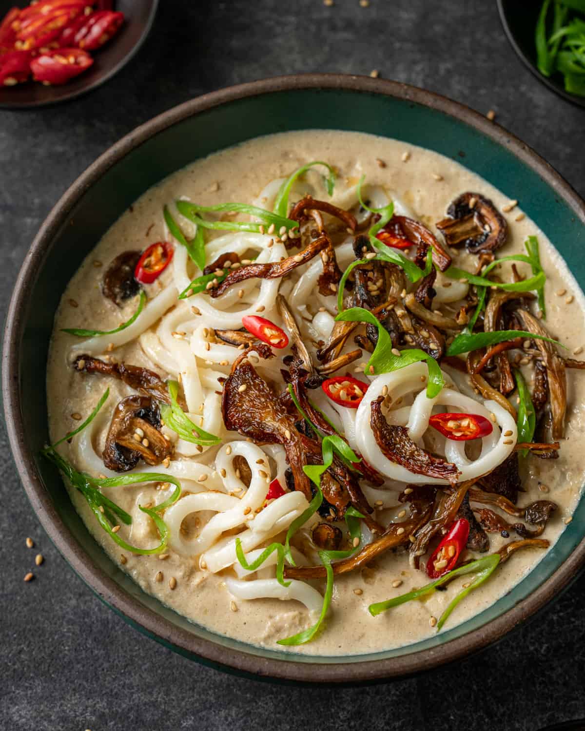 umami noodle soup in a bowl on a table.